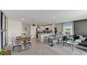 Open concept living area with kitchen and dining views at 2921 Hudson Hammock Way, St Cloud, FL 34773