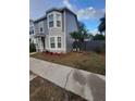 Two-story house with gray siding, landscaping, and a front entrance at 4530 Brook Hollow Cir, Winter Springs, FL 32708
