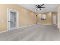 Living room with view into kitchen and access to balcony at 580 Brantley Terrace Way # 203, Altamonte Springs, FL 32714