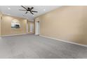 Open living room with kitchen pass-through and neutral walls at 580 Brantley Terrace Way # 203, Altamonte Springs, FL 32714