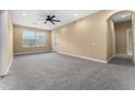 Spacious living room with carpet and ceiling fan at 580 Brantley Terrace Way # 203, Altamonte Springs, FL 32714