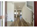 Bright and spacious entryway with wood-look floors, leading to living areas at 1798 Flourish Ave, Kissimmee, FL 34744