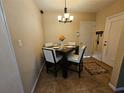 Cozy dining area with a square table and four chairs at 206 Cooke St, Leesburg, FL 34748