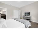 Bright bedroom with a plush bed and mirrored furniture at 218 Brooke'S Pl, Haines City, FL 33844