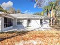 The exterior features a spacious patio and screened enclosure at 23917 Kays Way, Astatula, FL 34705