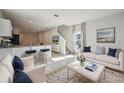 Bright living room with contemporary furniture and kitchen views at 251 Blueberry Ln, Davenport, FL 33837