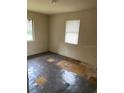 Bedroom with tile flooring and a window with blinds at 2732 Westside Dr, Leesburg, FL 34748