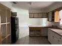 Basic kitchen with cabinets and appliances needing updates at 2732 Westside Dr, Leesburg, FL 34748