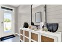 Bright entryway with white console table and large mirror at 3234 Belize Pl, Haines City, FL 33844