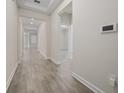 Bright hallway with tile flooring and access to other rooms at 8990 Ace Loop, Davenport, FL 33896