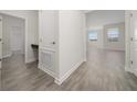 Clean hallway featuring tile floors and built-in storage at 8990 Ace Loop, Davenport, FL 33896
