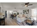 Bright living room featuring a comfy sofa, dining area, and kitchen view at 1309 E Parker St, Lakeland, FL 33801
