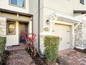 Townhome entry with paver walkway, stone accents and landscaping at 2766 White Isle Ln, Orlando, FL 32825