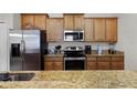 Modern kitchen with stainless steel appliances at 8939 Bismarck Palm Rd, Kissimmee, FL 34747