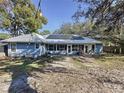Spacious backyard with solar panels and patio at 1215 Timberidge Dr, Lakeland, FL 33809