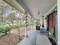 Relaxing front porch with rocking chairs and a swing at 1215 Timberidge Dr, Lakeland, FL 33809
