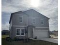 Two-story house with gray siding, white trim, and a two-car garage at 1445 Arbor Hill Dr, Deltona, FL 32725