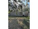 Mobile home with a wooden deck and surrounding trees at 15924 Old Cheney Hwy, Orlando, FL 32833