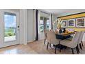 Bright dining room with table, chairs, and view of backyard at 3822 Rory Pond Ct, Lakeland, FL 33811