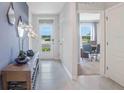 Bright and spacious entryway with view to an office at 441 Cinnamon Dr, Kissimmee, FL 34759