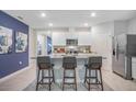 Modern kitchen with stainless steel appliances and granite countertops at 441 Cinnamon Dr, Kissimmee, FL 34759