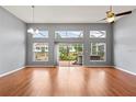 Spacious living area with hardwood floors and sliding doors to the patio at 4731 Summerbridge Cir, Leesburg, FL 34748
