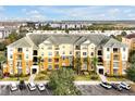 Exterior view of condo building, showcasing its design and parking area at 4814 Cayview Ave # 40613, Orlando, FL 32819