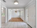 Bright entryway with tile floors and a view into the dining area at 702 Valencia Shores Dr, Winter Garden, FL 34787