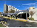 The Enclave Hotel & Suites entrance with covered walkway at 6165 Carrier Dr # 2401, Orlando, FL 32819