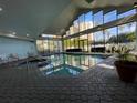 Indoor heated pool and jacuzzi with large windows at 6165 Carrier Dr # 2401, Orlando, FL 32819