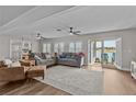 Spacious living room with access to a patio and a view of the water at 1409 Lake Marion Dr, Apopka, FL 32712