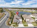Aerial view showing home's location in a quiet residential neighborhood near a lake at 15155 Mayberry Dr, Winter Garden, FL 34787