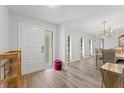 Bright entryway with hardwood floors and views to dining area at 6829 Bittersweet Ln, Orlando, FL 32819