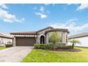 One-story house with a brick driveway and well-manicured lawn at 11637 Meadow Grove Cir, Orlando, FL 32836