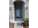 Light blue front door entryway with accent lighting at 3509 Yarian Dr, Haines City, FL 33844
