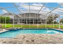 Relaxing pool and spa with a covered patio area at 1550 Observer Ln, Davenport, FL 33896