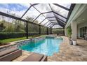 Resort-style pool and spa with covered lanai and plenty of lounge space at 2205 Lake Sylvan Oaks Ct, Sanford, FL 32771