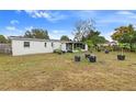 Large backyard with a screened patio and potted plants at 2336 Nansen Ave, Orlando, FL 32817