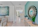 Bright and airy entryway with a large mirror and view to the living room at 3535 Sandalwood Isle Way, Ocoee, FL 34761