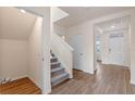 Entryway with stairs, coat closet and view into living room at 5482 Hayloft Dr, Apopka, FL 32712