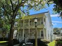 Two-story house with columns and a lamp post at 821 Veranda Pl, Celebration, FL 34747