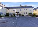 Condo building exterior showcasing a classic design and parking area at 1500 Gay Rd # 7A, Winter Park, FL 32789