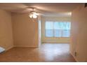 Living room with tile floor and bay window at 4572 Commander Dr # 1227, Orlando, FL 32822