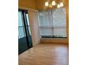 Bright dining area with wood flooring and access to balcony at 1310 Stearman Ct # 4, Orlando, FL 32825