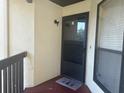 Condo entrance with a door and small welcome mat at 1310 Stearman Ct # 4, Orlando, FL 32825