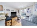 Bright living room with hardwood floors and comfortable sofa at 151 E Washington St # 424, Orlando, FL 32801