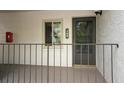 Condo entry with a dark-grey door and a window at 2 Escondido Cir # 190, Altamonte Springs, FL 32701