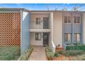 Front view of a two-story condo building with a walkway at 2 Escondido Cir # 190, Altamonte Springs, FL 32701