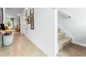 Bright hallway with carpeted staircase leading to the upper level at 2766 Puffin Pl, Davenport, FL 33837