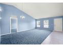 Spacious living room with light blue walls and carpeted floor at 3621 Ronda Dr, Deltona, FL 32738
